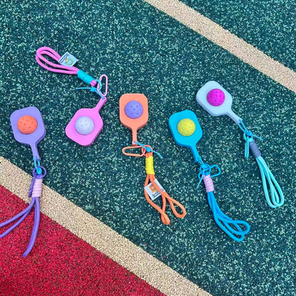 RallyWell pressable pickleball pop keychain in multiple colours